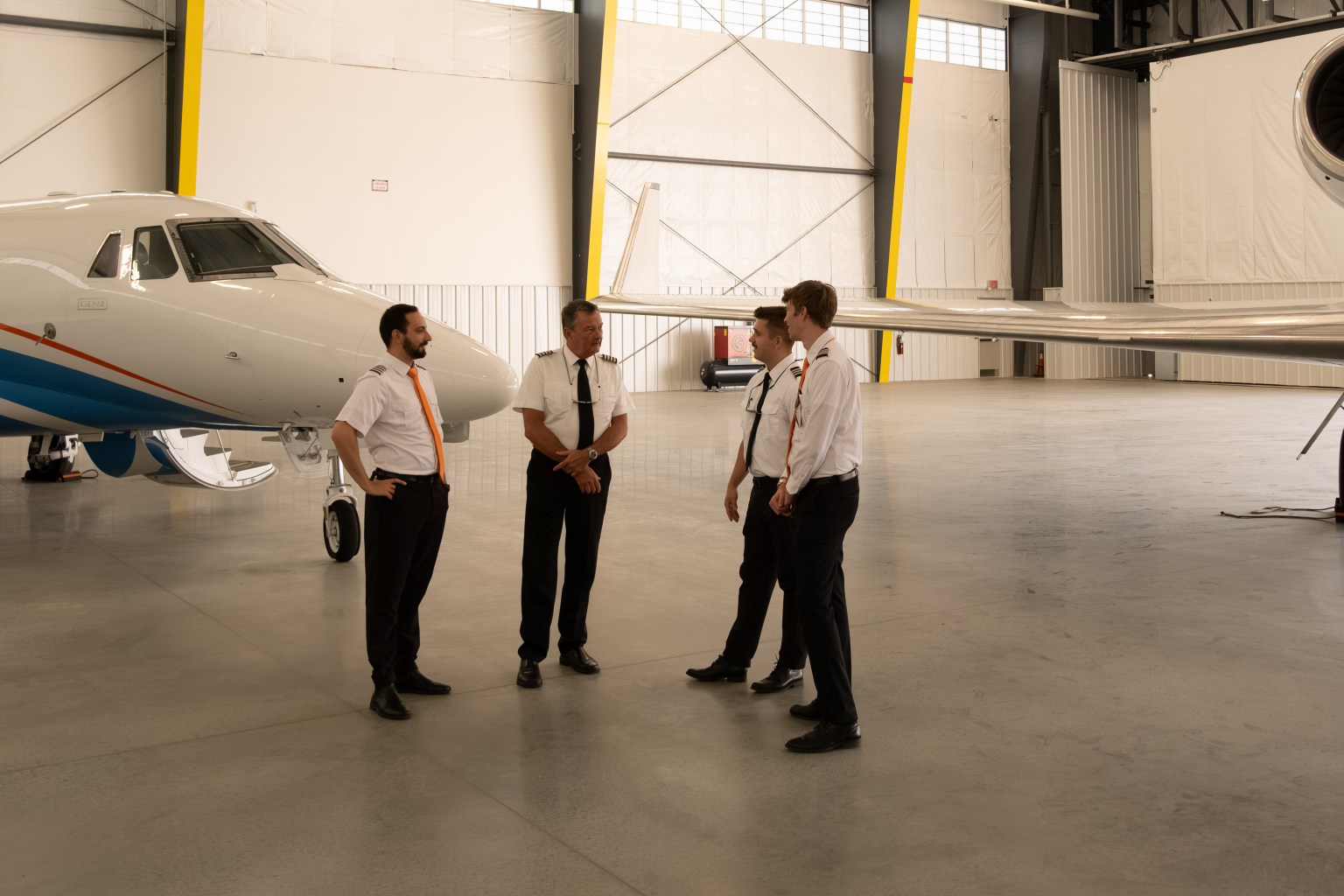 Fly Alliance flight crew in the maintenance hangar