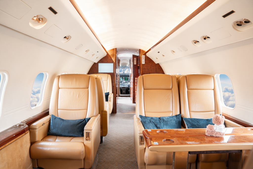 Cabin looking aft — club seating with tables