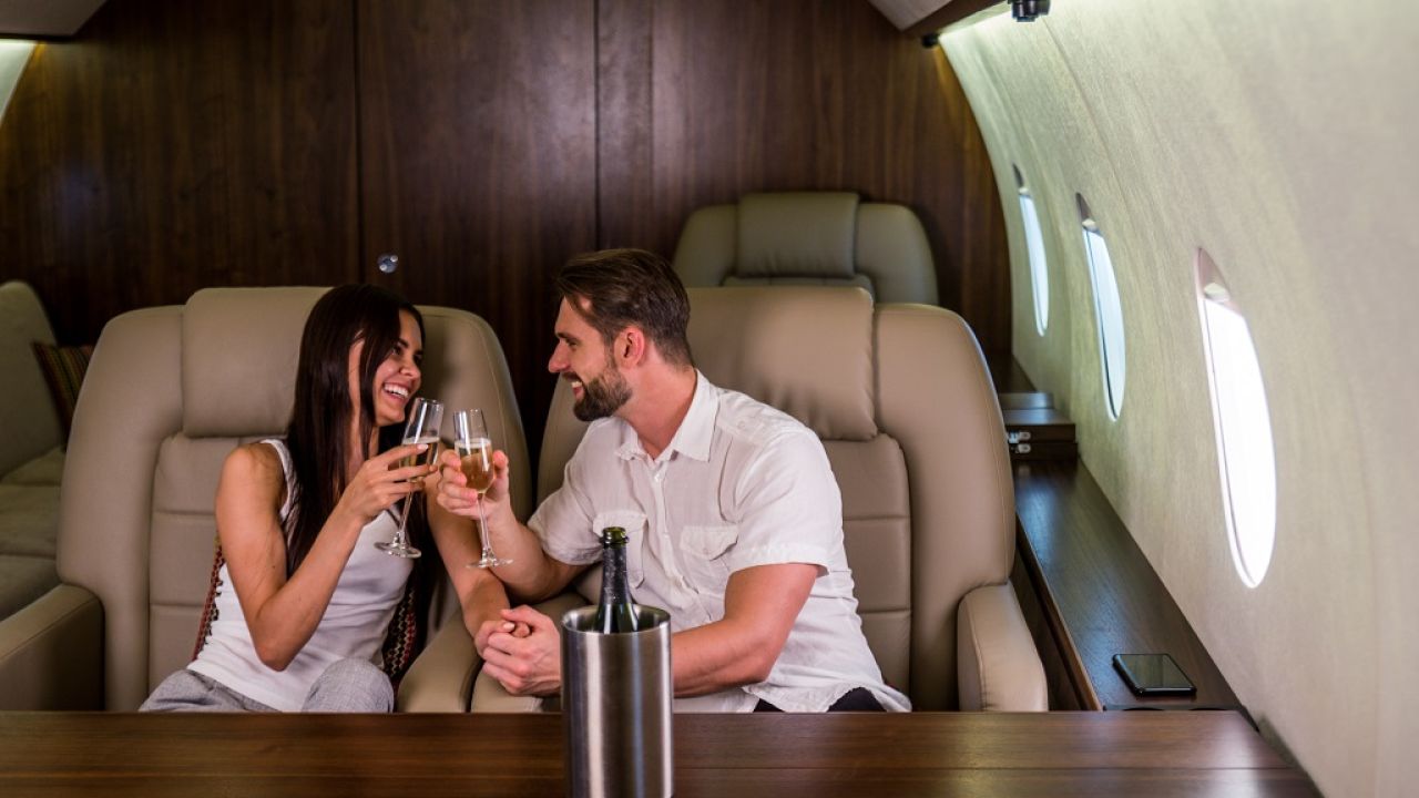 a couple having good time in private jet
